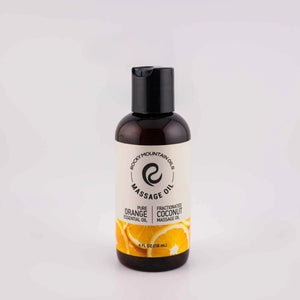 Bottle of Orange Massage Oil, 4oz, from Rocky Mountain Oils, with a clean label design against a natural background.