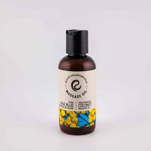 Bottle of Rocky Mountain Oils true blue massage oil on a white background