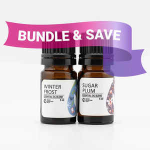 Two essential oil bottles labeled 'Winter Frost' and 'Sugar Plum' with a 'Bundle & Save' banner on a white background.